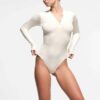 COTTON RIB LONG SLEEVE HENLEY BODYSUIT COTTON RIB LONG SLEEVE HENLEY BODYSUIT