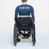SKIMS FOR TEAM USA SIGNATURE SWIM PARALYMPIC LONG SLEEVE CROPPED T-SHIRT SKIMS FOR TEAM USA SIGNATURE SWIM PARALYMPIC LONG SLEEVE CROPPED T-SHIRT